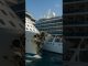 Cruise ship severely damaged after port crash — bow crushed, lifeboats deployed.